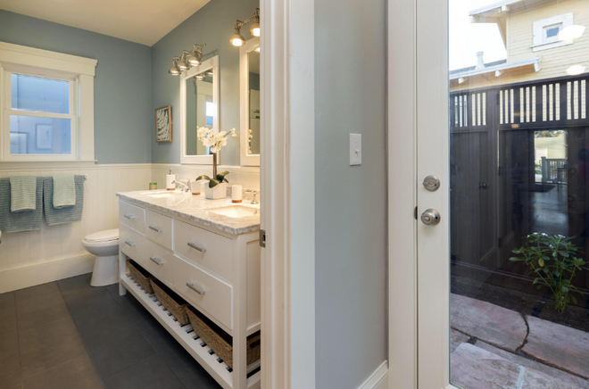 Interior bathroom painting in Marin County by MoonDance Painting — blue-gray walls with white trim and vanity